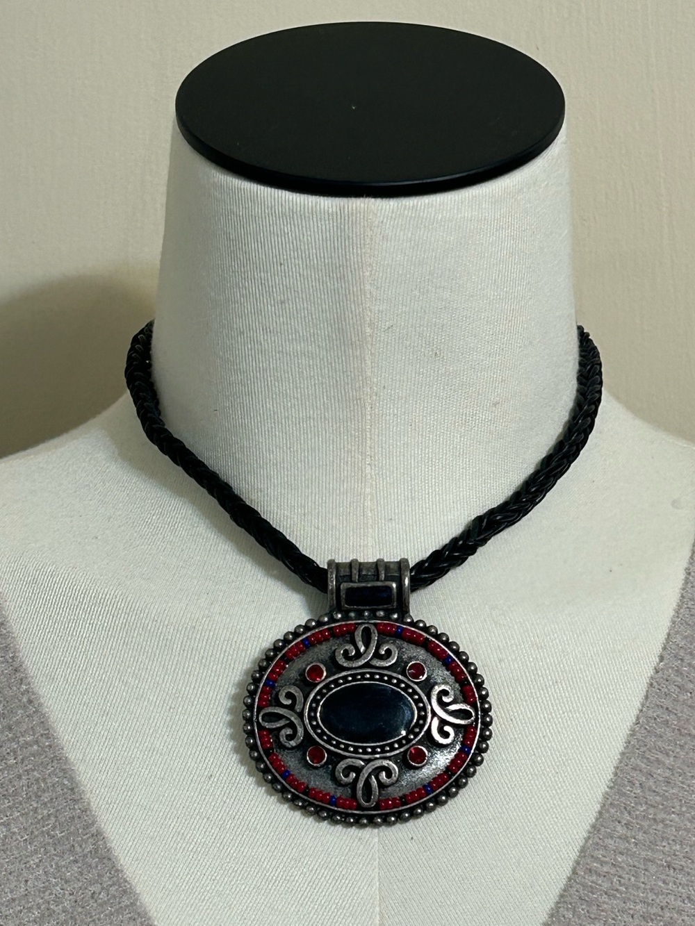 CHICOS MEDALLION ON A BRAIDED CORD